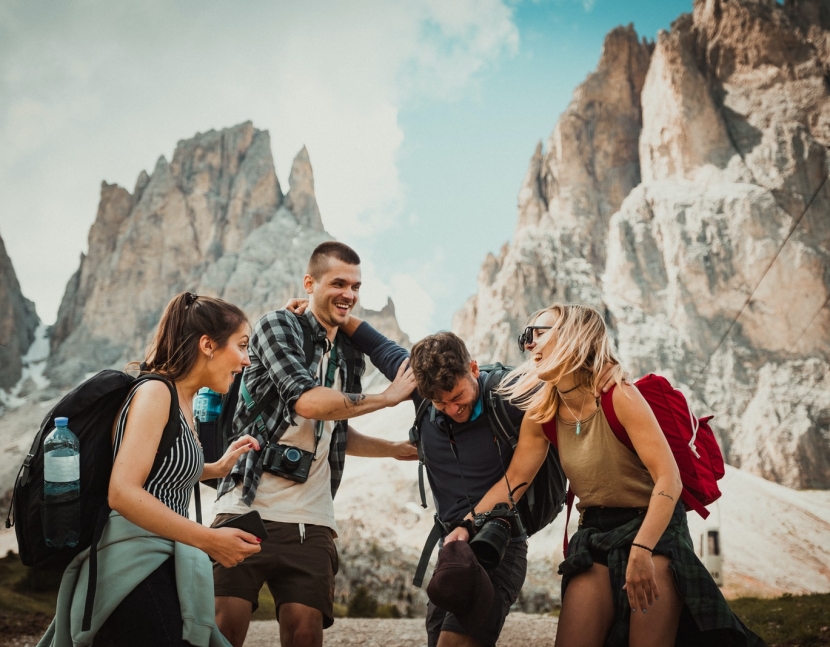 low-angle photography of two men playing beside two women